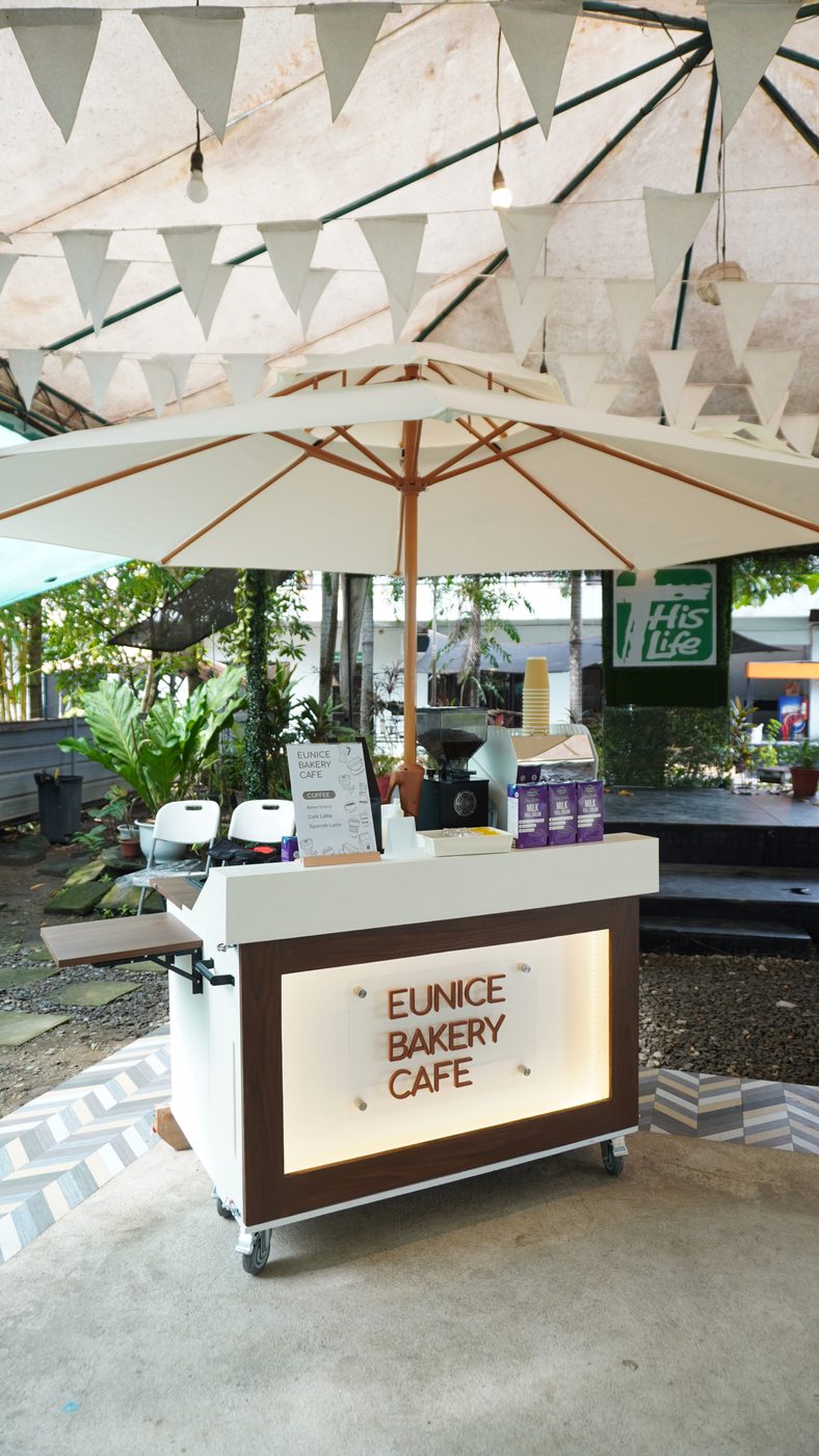 The cart set up outdoors under a parasol